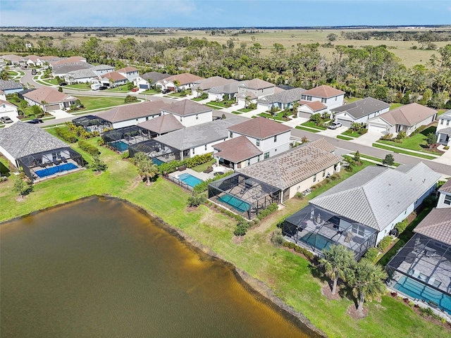 aerial perspective of suburban area featuring a large body of water