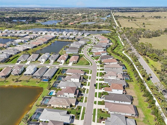 view of property location with nearby suburban area and a nearby body of water