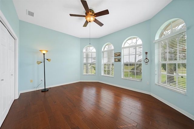16531 San Edmundo Rd, Punta Gorda, FL 33955 - empty room with a ceiling fan, healthy amount of natural light, wood-type flooring, and baseboards