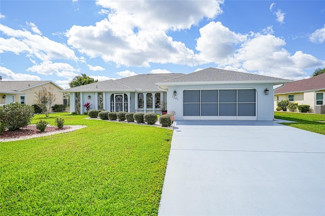 single story home featuring concrete driveway, an attached garage, a front lawn, and stucco siding