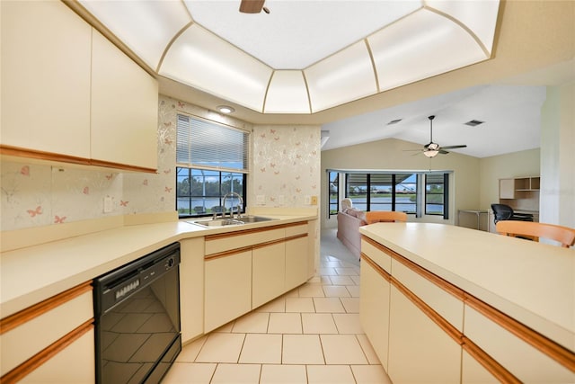 kitchen with a sink, a ceiling fan, black dishwasher, light countertops, and wallpapered walls