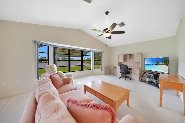 living area featuring light carpet, visible vents, baseboards, ceiling fan, and vaulted ceiling