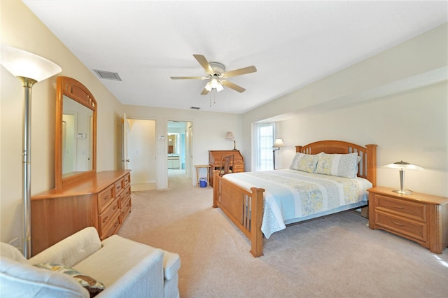 bedroom with light colored carpet, visible vents, and ceiling fan