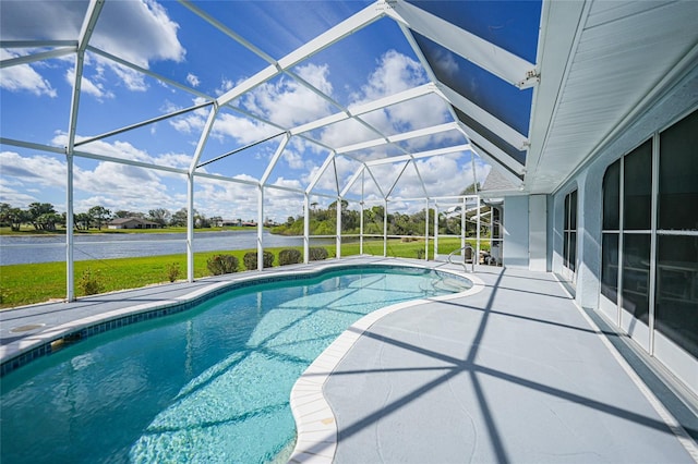 outdoor pool with a lanai, a patio area, and a water view