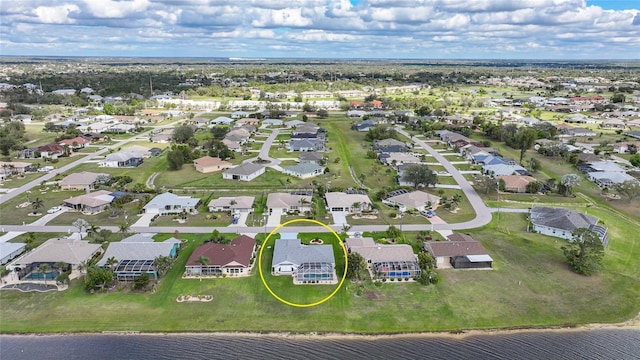 birds eye view of property with a residential view