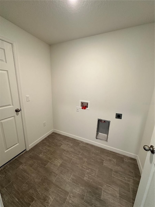 laundry area featuring hookup for a washing machine, wood tiled floor, hookup for an electric dryer, laundry area, and baseboards