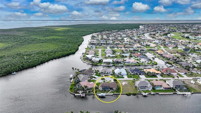 bird's eye view featuring a water view and a residential view