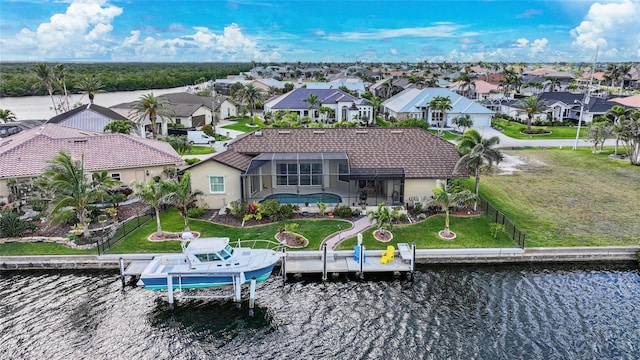 birds eye view of property featuring a water view and a residential view