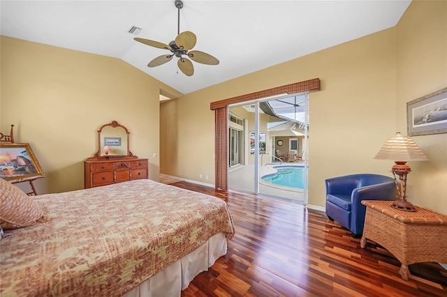 bedroom featuring lofted ceiling, wood finished floors, visible vents, baseboards, and access to exterior