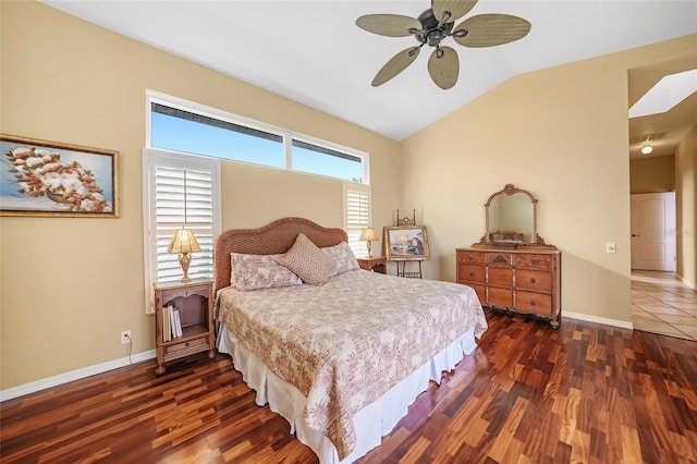 bedroom featuring ceiling fan, baseboards, vaulted ceiling, and dark wood-style flooring