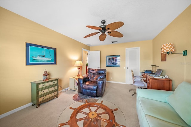 living area featuring baseboards, a ceiling fan, visible vents, and light colored carpet