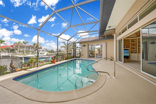 outdoor pool featuring a lanai and a patio