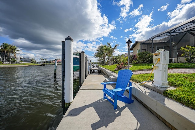 dock area featuring a lanai and a water view