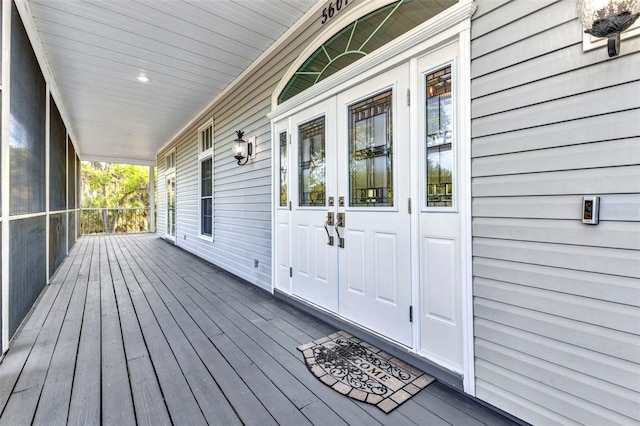wooden terrace with a porch