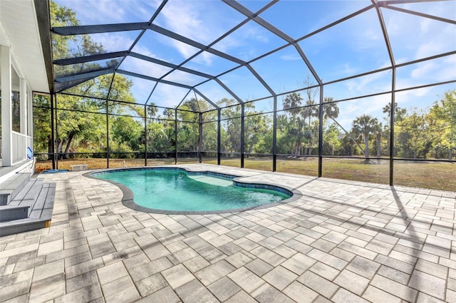 outdoor pool featuring a lanai and a patio