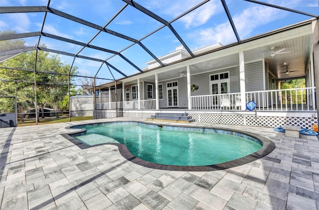 outdoor pool featuring a patio, french doors, and a ceiling fan
