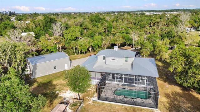 birds eye view of property with a forest view