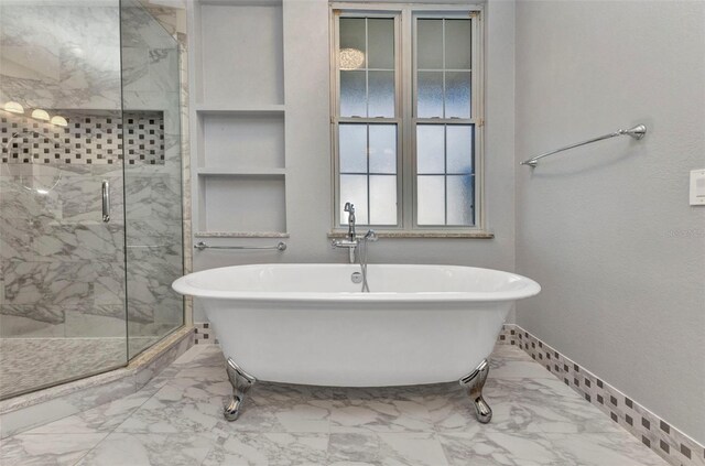 5601 Taylor Rd, Punta Gorda, FL 33950 - bathroom with marble finish flooring, a marble finish shower, baseboards, and a freestanding bath