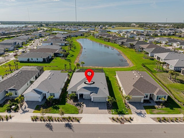 bird's eye view with a water view and a residential view