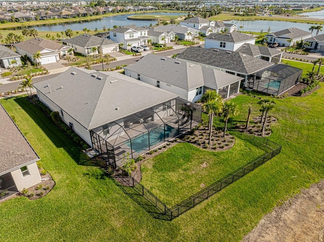 aerial view with a water view and a residential view