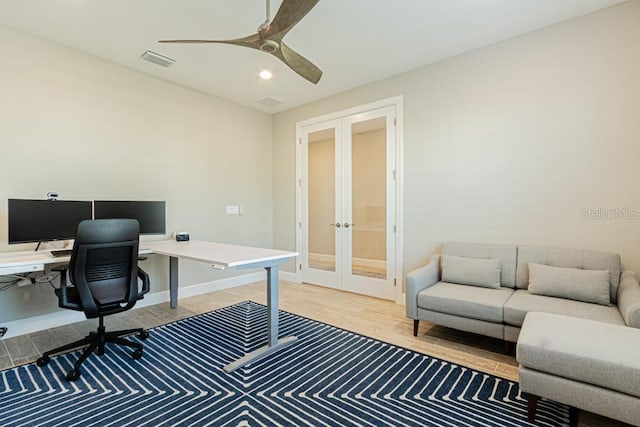 office area with french doors, visible vents, ceiling fan, wood finished floors, and baseboards