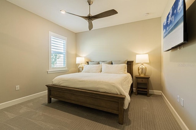 carpeted bedroom featuring a ceiling fan and baseboards