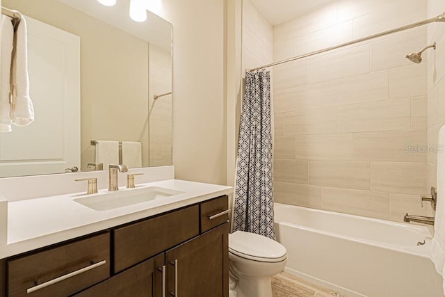 bathroom with shower / bath combination with curtain, vanity, toilet, and wood finished floors