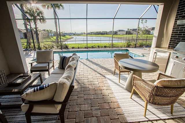 exterior space with outdoor lounge area, glass enclosure, a water view, and an outdoor pool