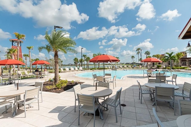 view of patio featuring a community pool