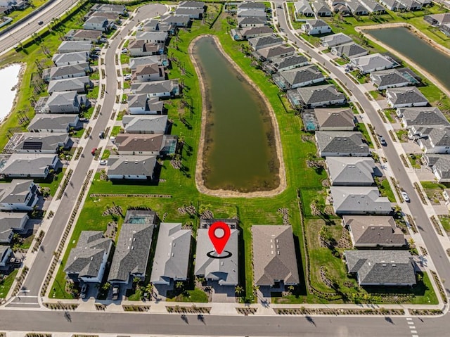 aerial view featuring a residential view and a water view