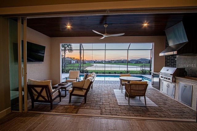 view of patio featuring an outdoor kitchen, a lanai, outdoor lounge area, grilling area, and an outdoor pool