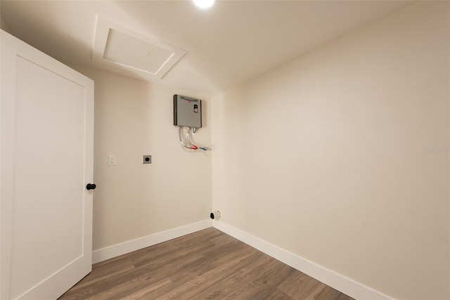 washroom featuring hookup for an electric dryer, laundry area, dark wood-style flooring, baseboards, and attic access