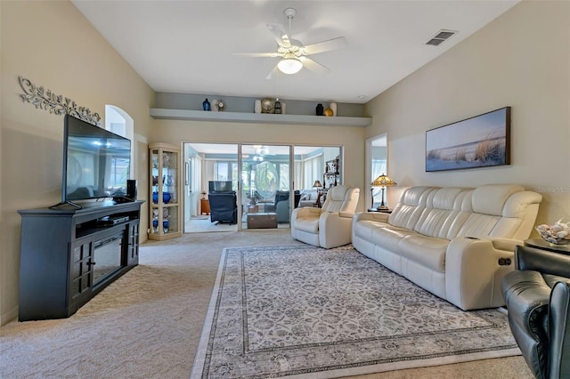 living area with ceiling fan, visible vents, and carpet flooring