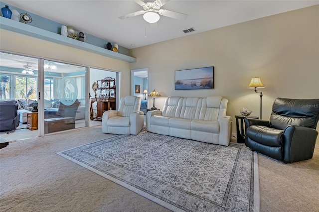 carpeted living room featuring ceiling fan and visible vents