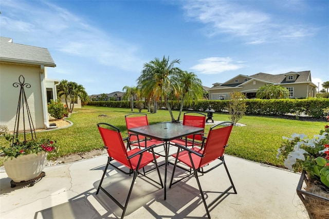 view of patio with a residential view and outdoor dining area