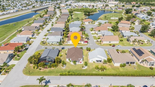 aerial view featuring a water view and a residential view