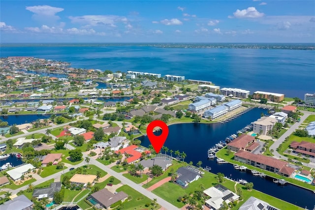 aerial view with a residential view and a water view