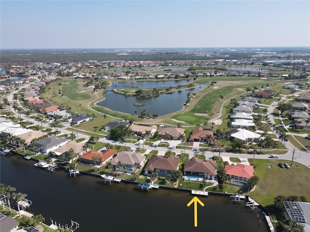 drone / aerial view with a water view, a residential view, and golf course view