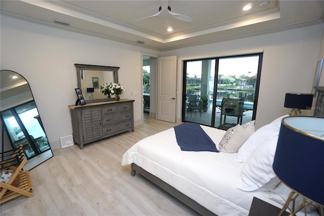 bedroom with a raised ceiling, ornamental molding, access to outside, light wood-style floors, and recessed lighting