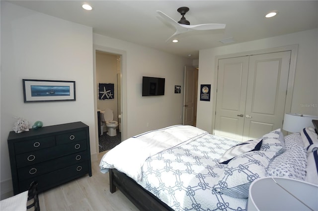 bedroom with a closet, light wood-type flooring, a ceiling fan, and recessed lighting