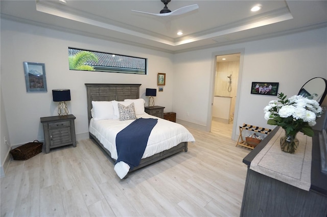 bedroom with light wood-style flooring, a raised ceiling, crown molding, and recessed lighting