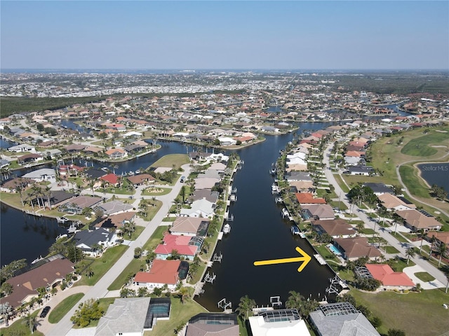 bird's eye view featuring a residential view and a water view