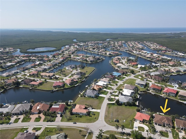 bird's eye view featuring a water view and a residential view