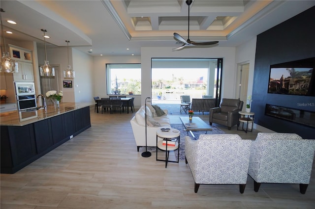 living area with crown molding, coffered ceiling, beamed ceiling, and recessed lighting