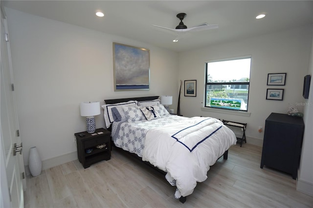 bedroom with recessed lighting, baseboards, and light wood finished floors