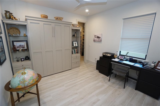 office space with light wood finished floors, baseboards, a ceiling fan, and recessed lighting