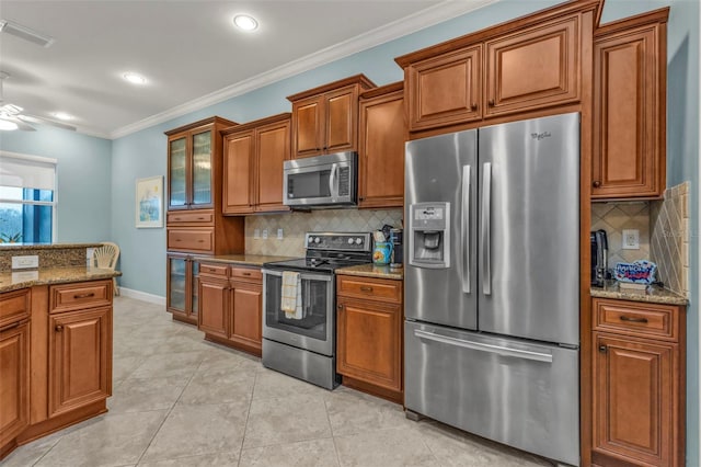 kitchen with brown cabinetry and stainless steel appliances