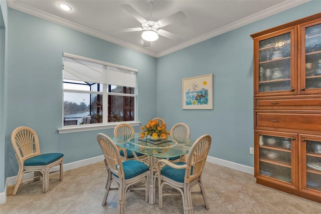 dining room with ceiling fan, ornamental molding, and baseboards