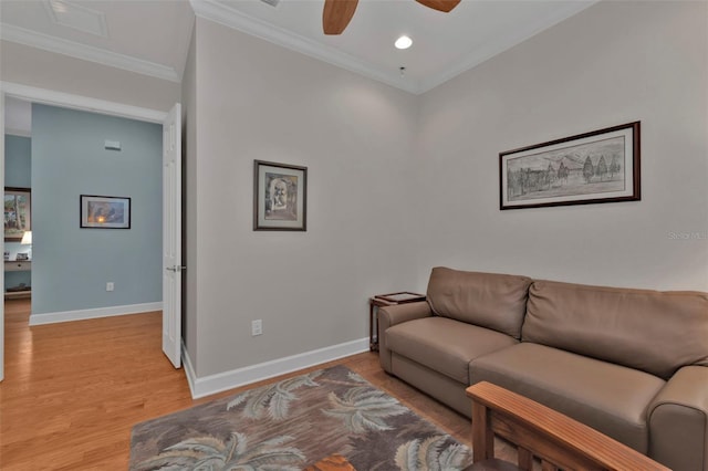 living room featuring crown molding, recessed lighting, light wood-style flooring, ceiling fan, and baseboards