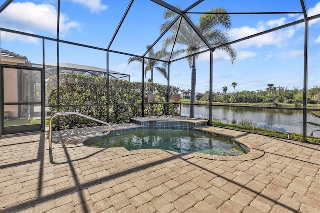 pool with a lanai, a patio area, and a water view